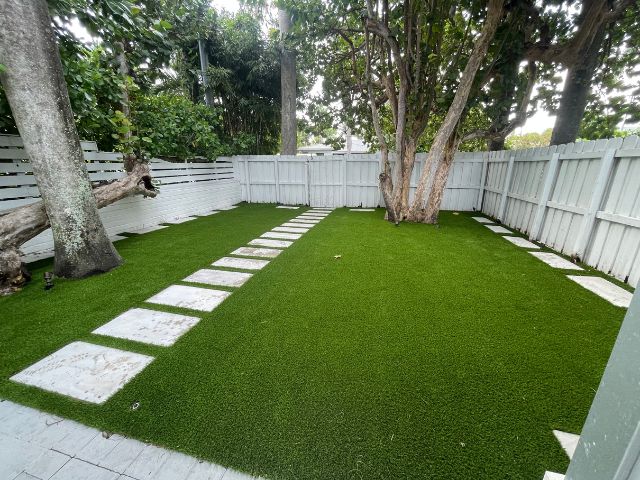 On-Time Turf experts installing artificial grass in Kendall, FL, ensuring a lush and flawless finish for residential and commercial properties.